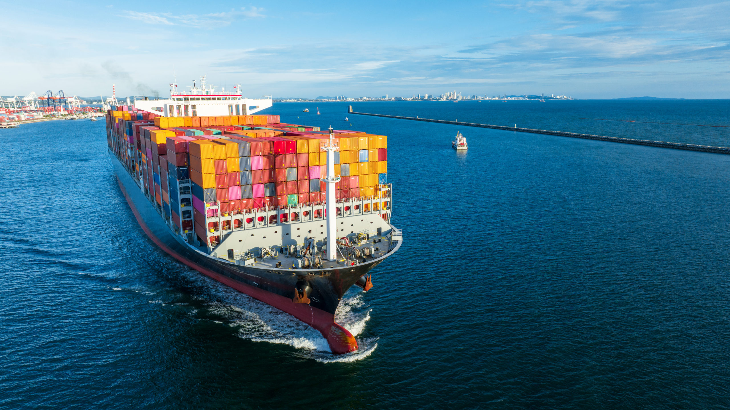 An aerial view of a cargo ship carrying containers